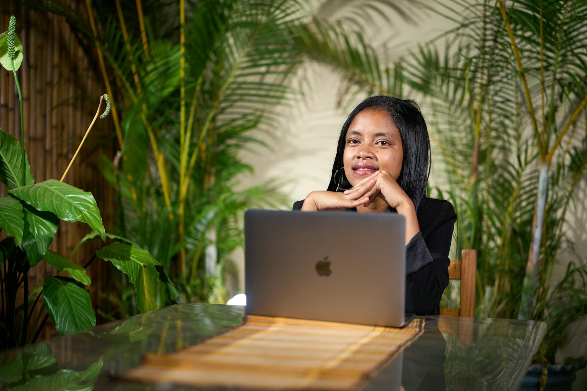 Professional working in calm office with plants